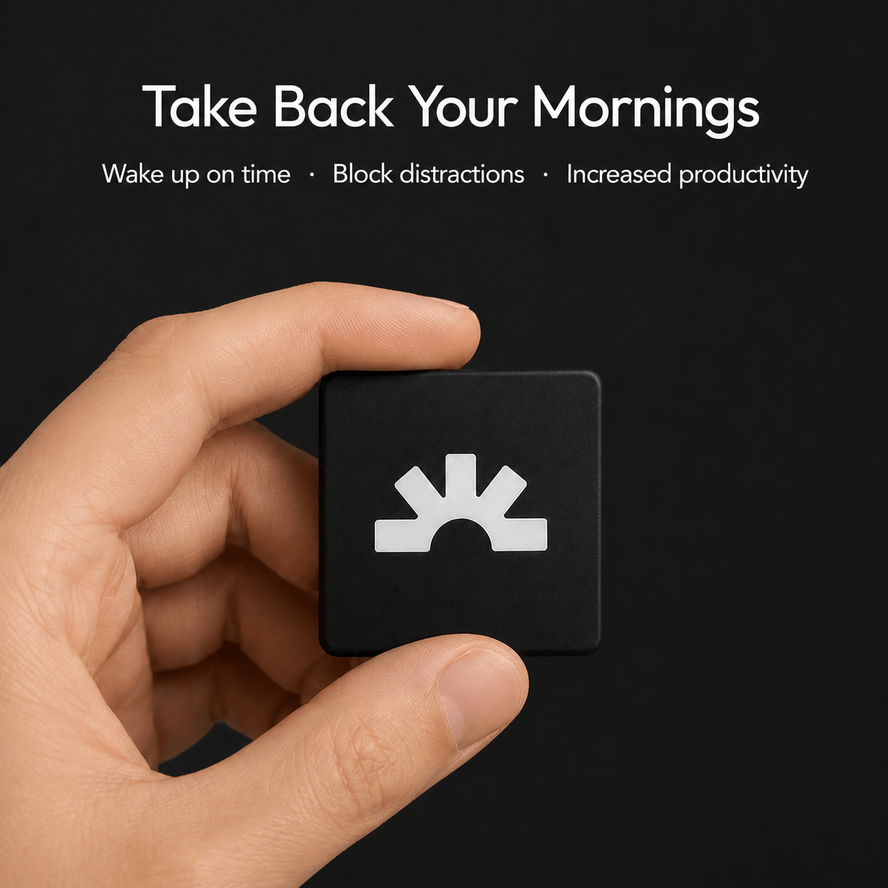Hand holding the black Lumi Dock